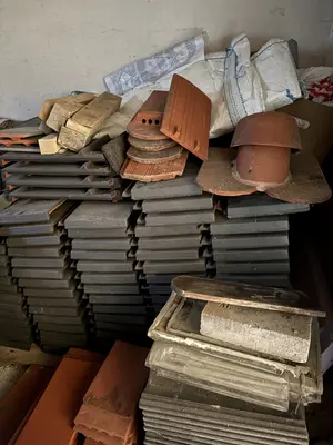 Assorted roof tiles and building materials
